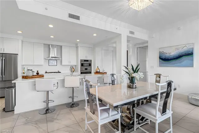 a living room with furniture or couch and a kitchen