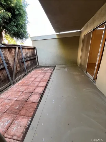 a view of a backyard with a small cabin and a chair