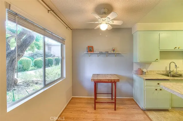 a view of a livingroom with furniture window and wooden floor