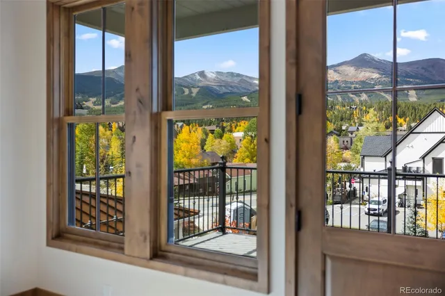 a view of balcony with wooden floor and city view