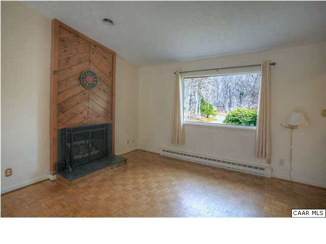 2698 Rio Mills Road Earlysville, VA 22936 - Photo 13 of 24 a room with windows and a fireplace