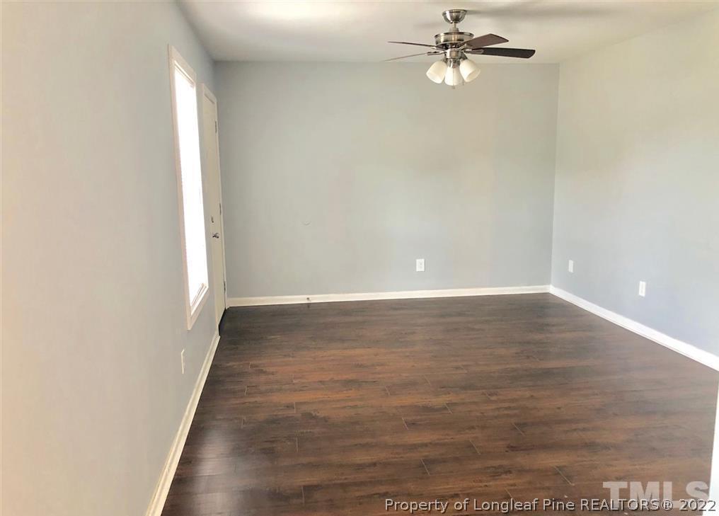 630 Middle Street, Unit 2 Durham, NC 27703 - Photo 4 of 5 wooden floor in an empty room with a window