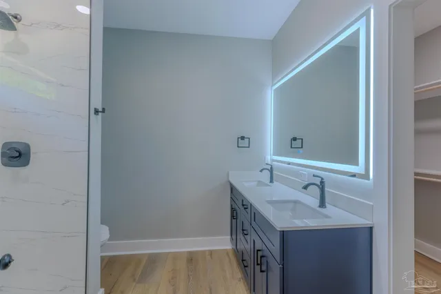 a bathroom with a sink and a mirror
