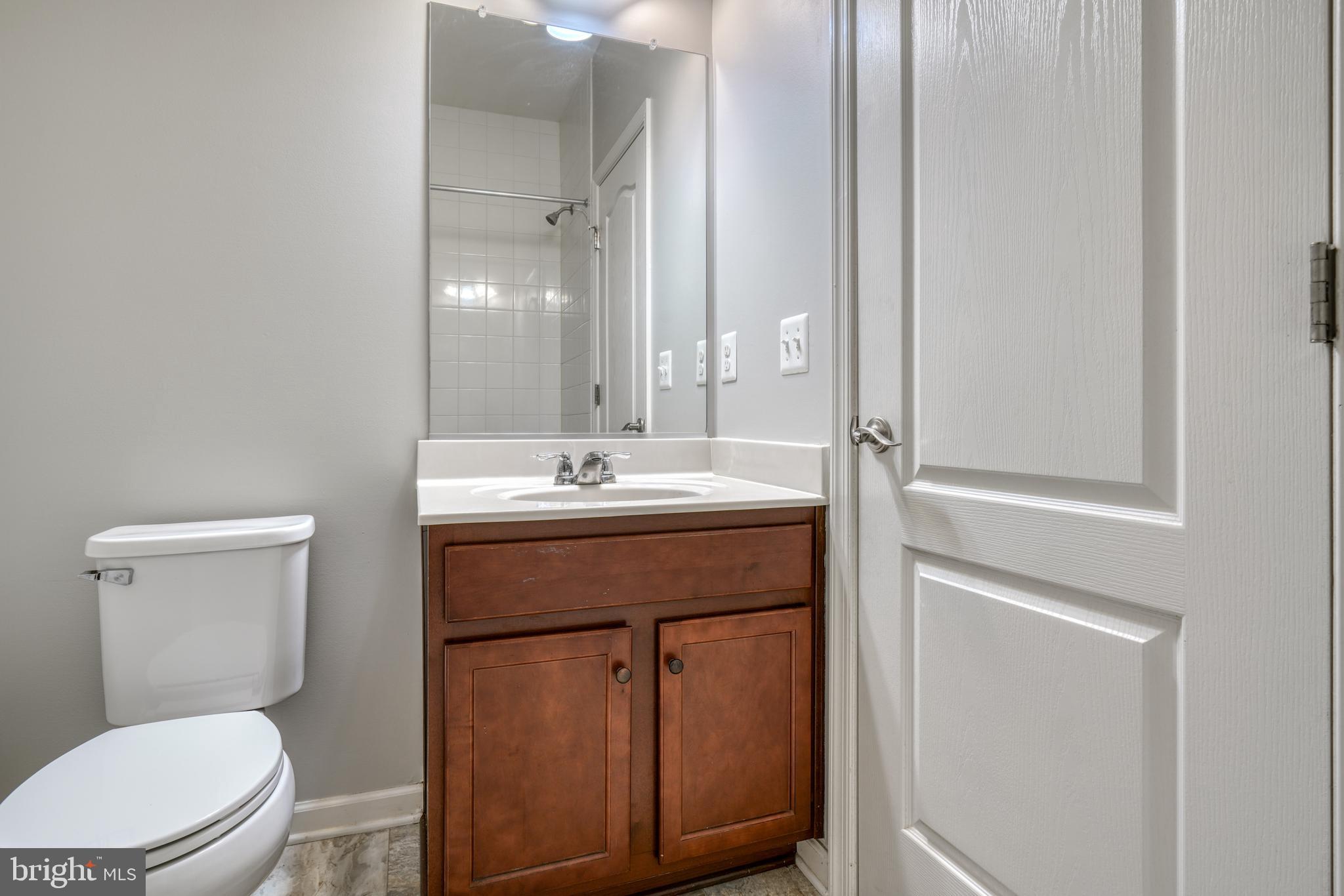 985 Morgan Run Road Middle River, MD 21220 - Photo 31 of 33 a bathroom with a sink a toilet and mirror