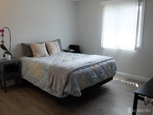 a bedroom with a bed and a table in it