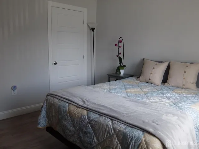 a bedroom with a bed and a table