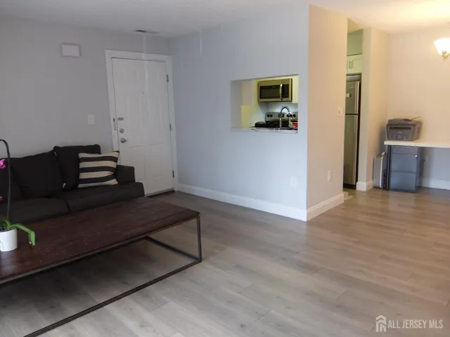 a view of a workspace with furniture and a chandelier