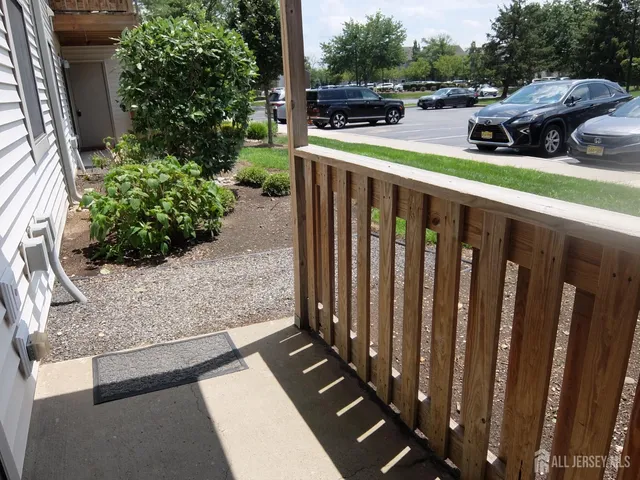 a couple of cars parked in front of a yard