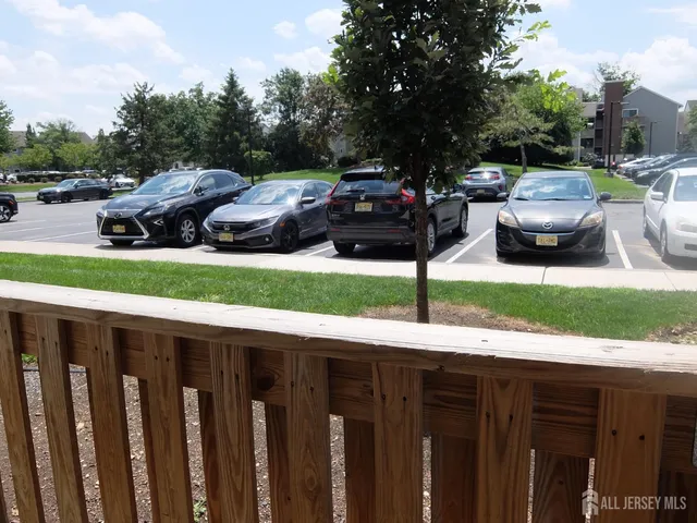 a view of yard from deck with patio
