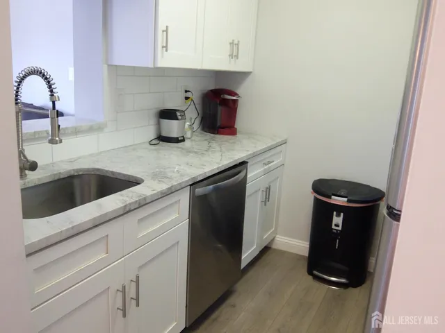 a stove top oven sitting inside of a kitchen