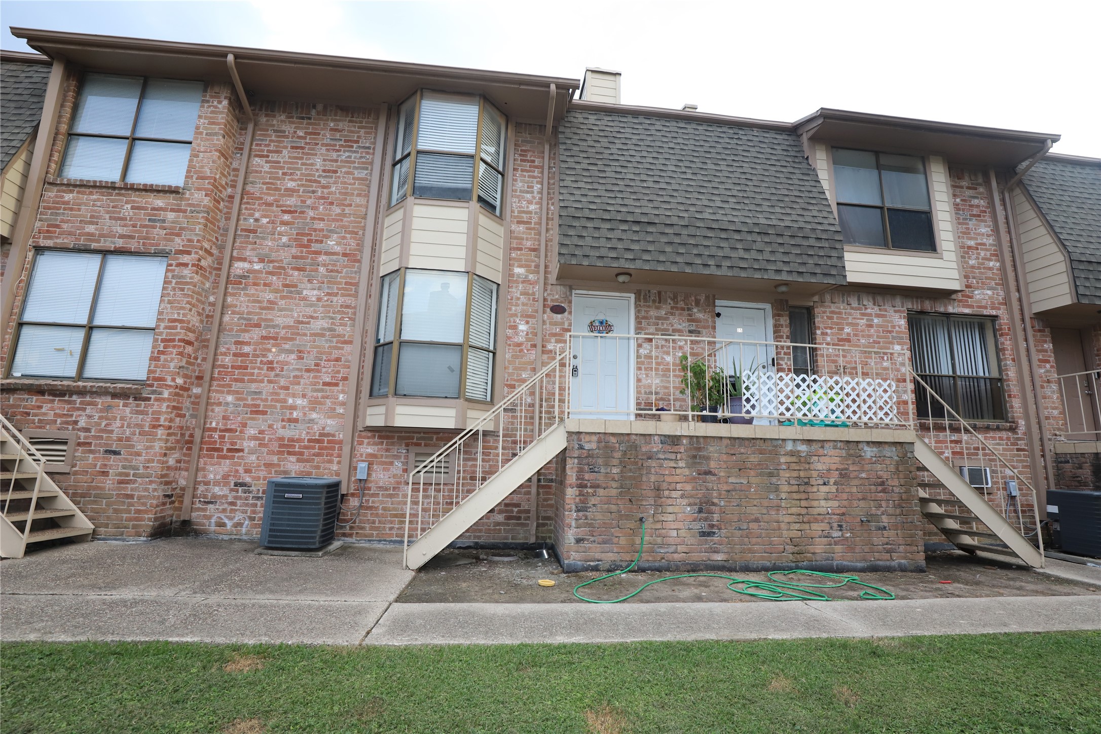 a view of front door of house with yard