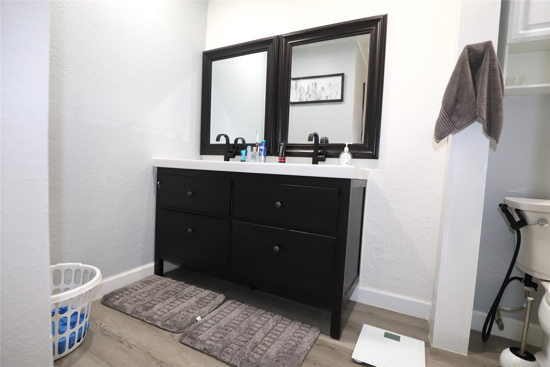 2103 Place Rebecca Lane, Unit D6 Houston, TX 77090 - Photo 16 of 31 a bathroom with a sink and a mirror
