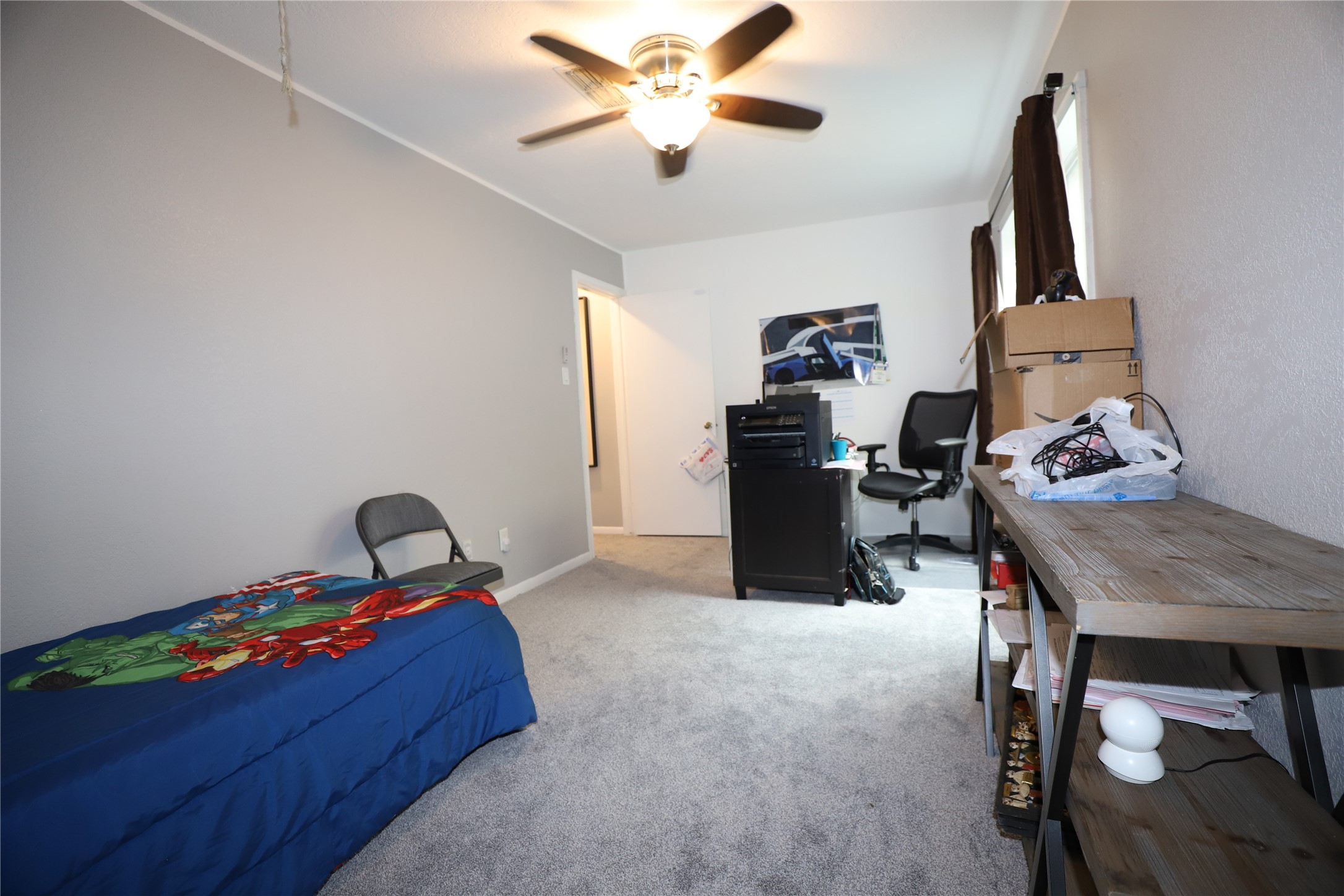 2103 Place Rebecca Lane, Unit D6 Houston, TX 77090 - Photo 19 of 31 a living room with furniture and a flat screen tv