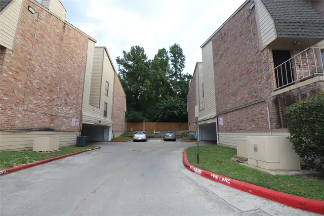 a view of a parked cars in front of a house