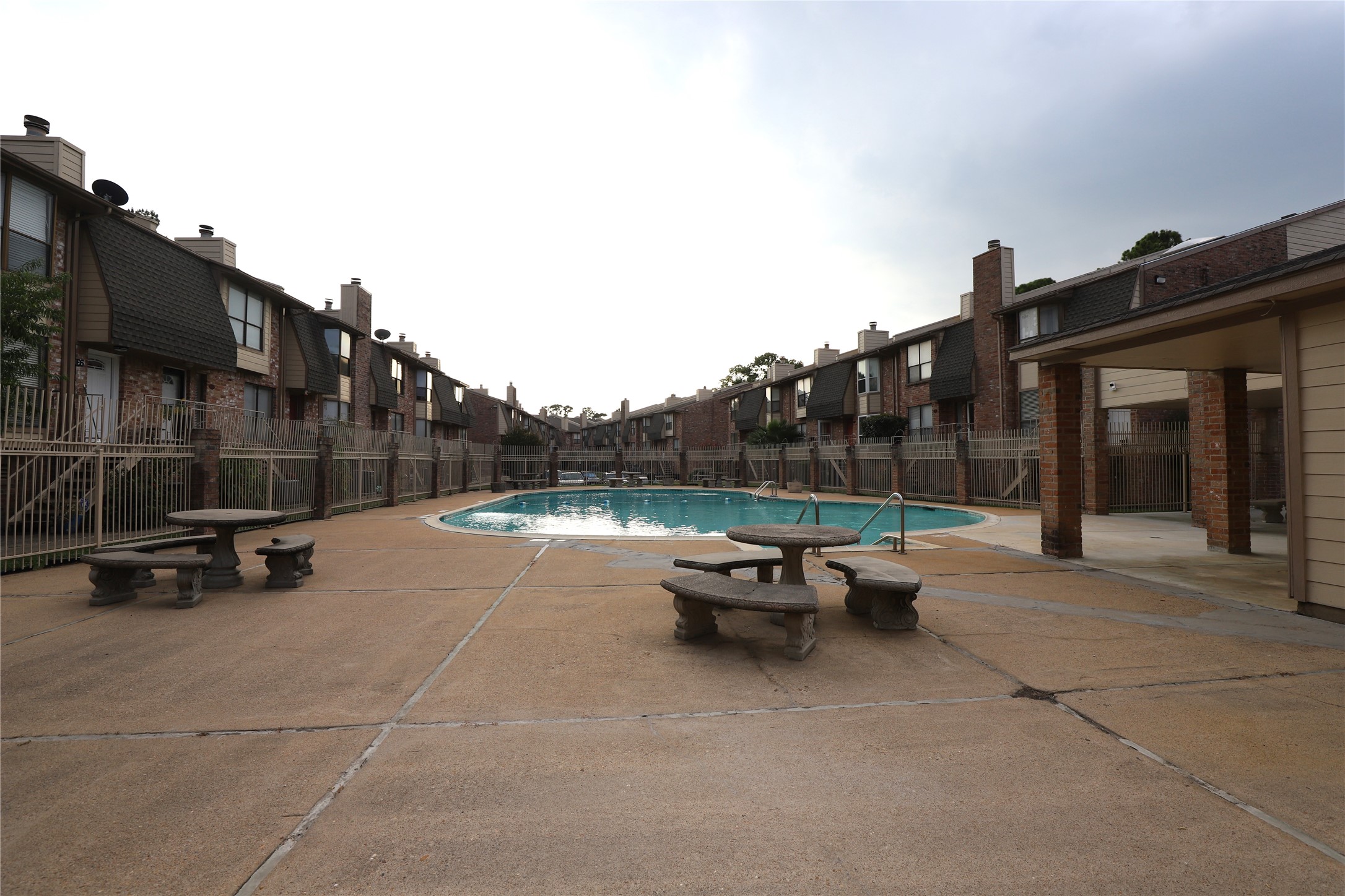2103 Place Rebecca Lane, Unit D6 Houston, TX 77090 - Photo 28 of 31 a view of backyard with table and chairs and wooden fence