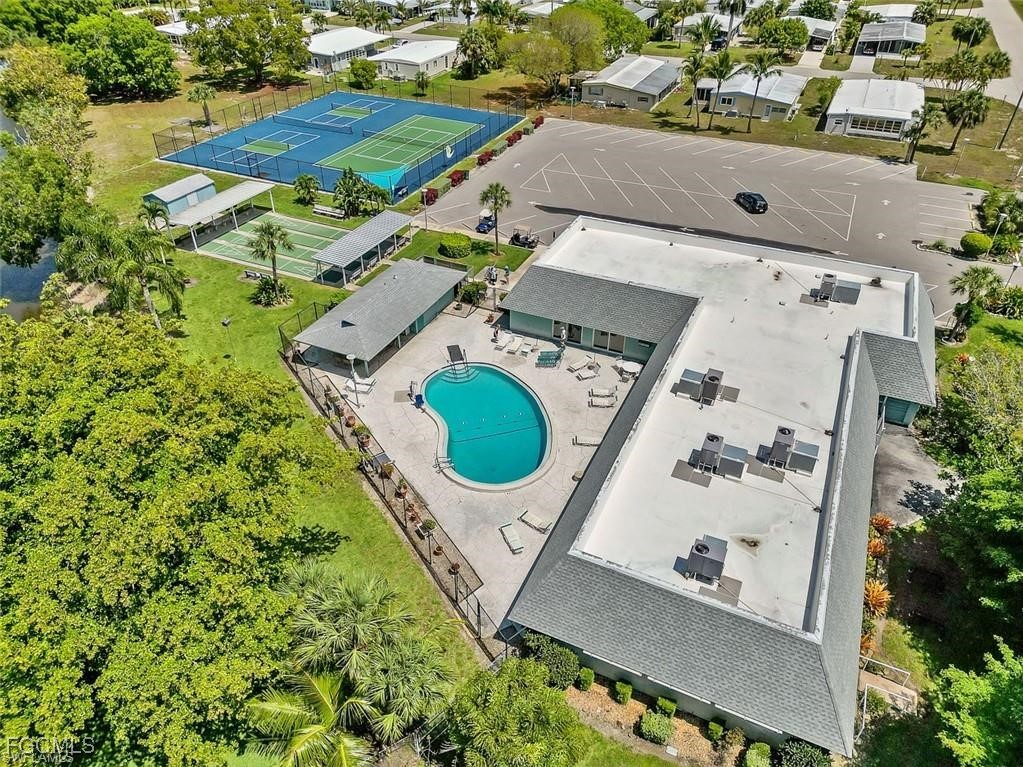 171 Pine Key Lane Naples, FL 34114 - Photo 5 of 8 an aerial view of a house with a swimming pool and outdoor space