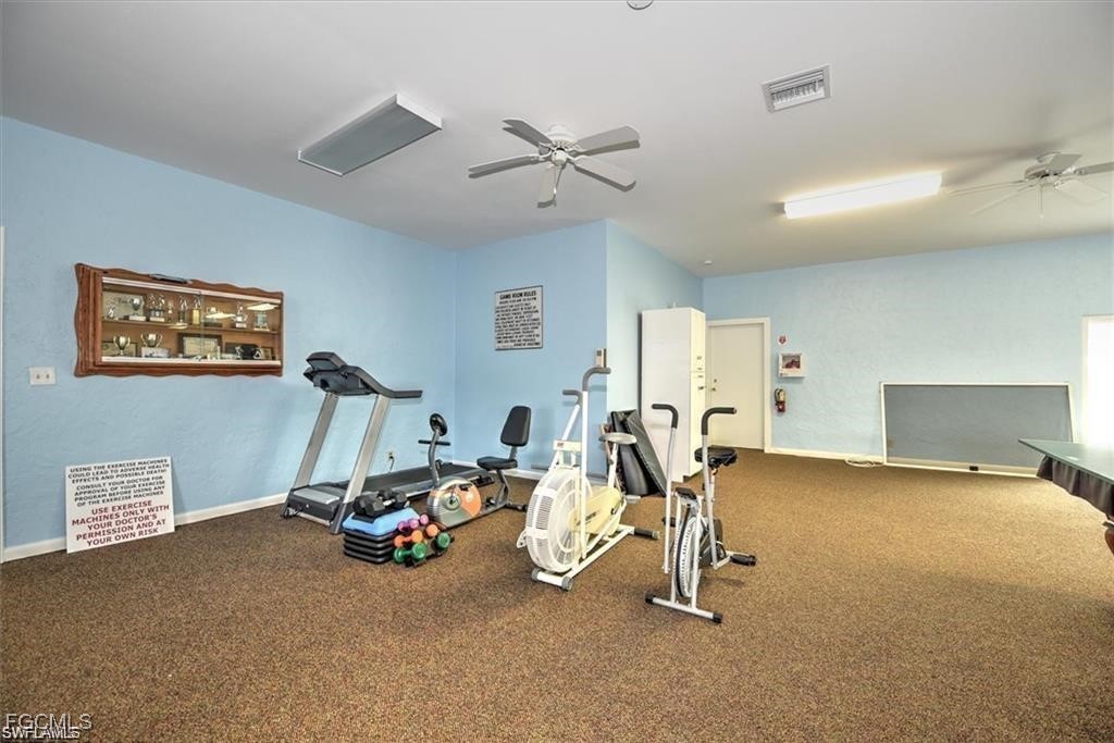 171 Pine Key Lane Naples, FL 34114 - Photo 6 of 8 a view of a room with gym equipment