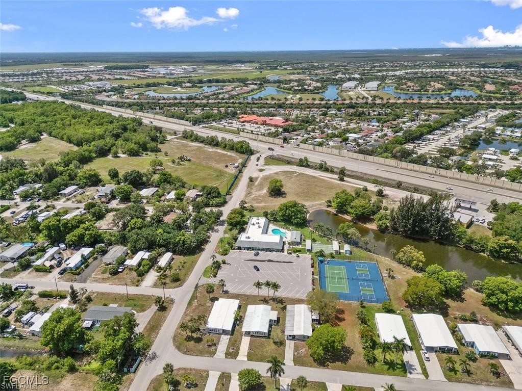 171 Pine Key Lane Naples, FL 34114 - Photo 8 of 8 an aerial view of residential houses with outdoor space