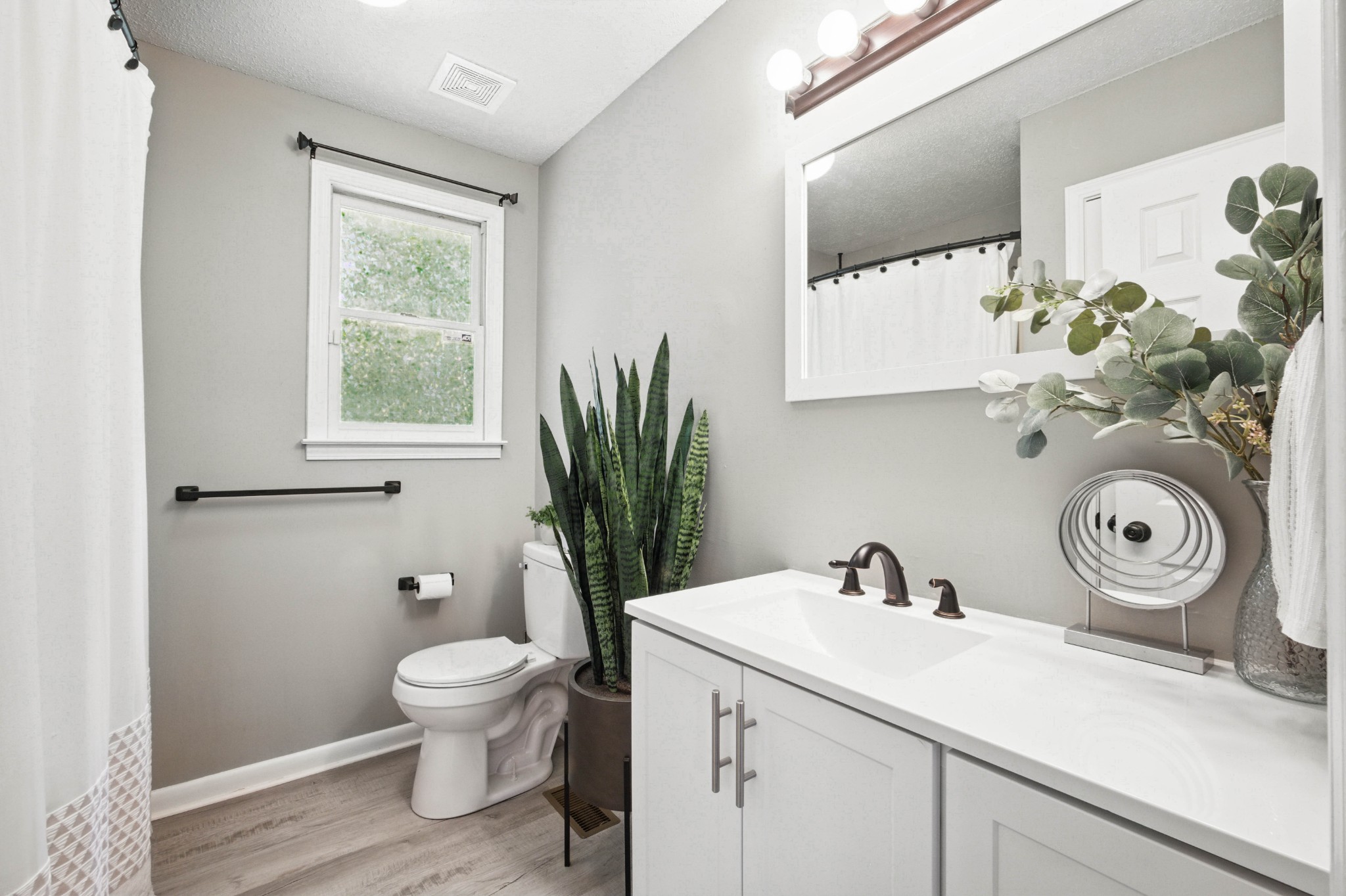 763 Needmore Road Clarksville, TN 37040 - Photo 17 of 43 a bathroom with a toilet sink and mirror
