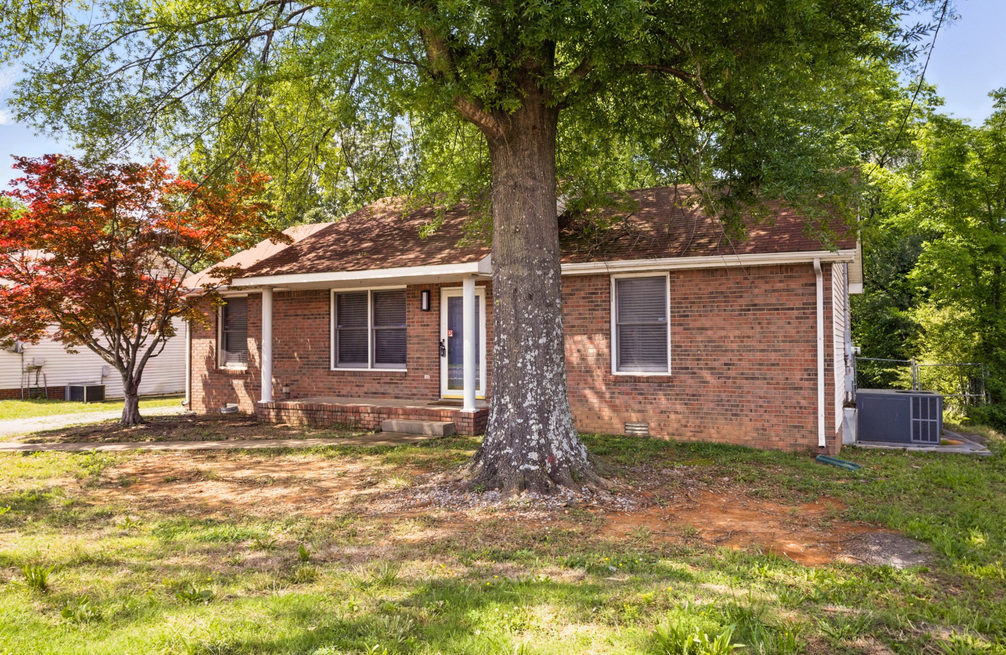 763 Needmore Road Clarksville, TN 37040 - Photo 41 of 43 a front view of a house with garden