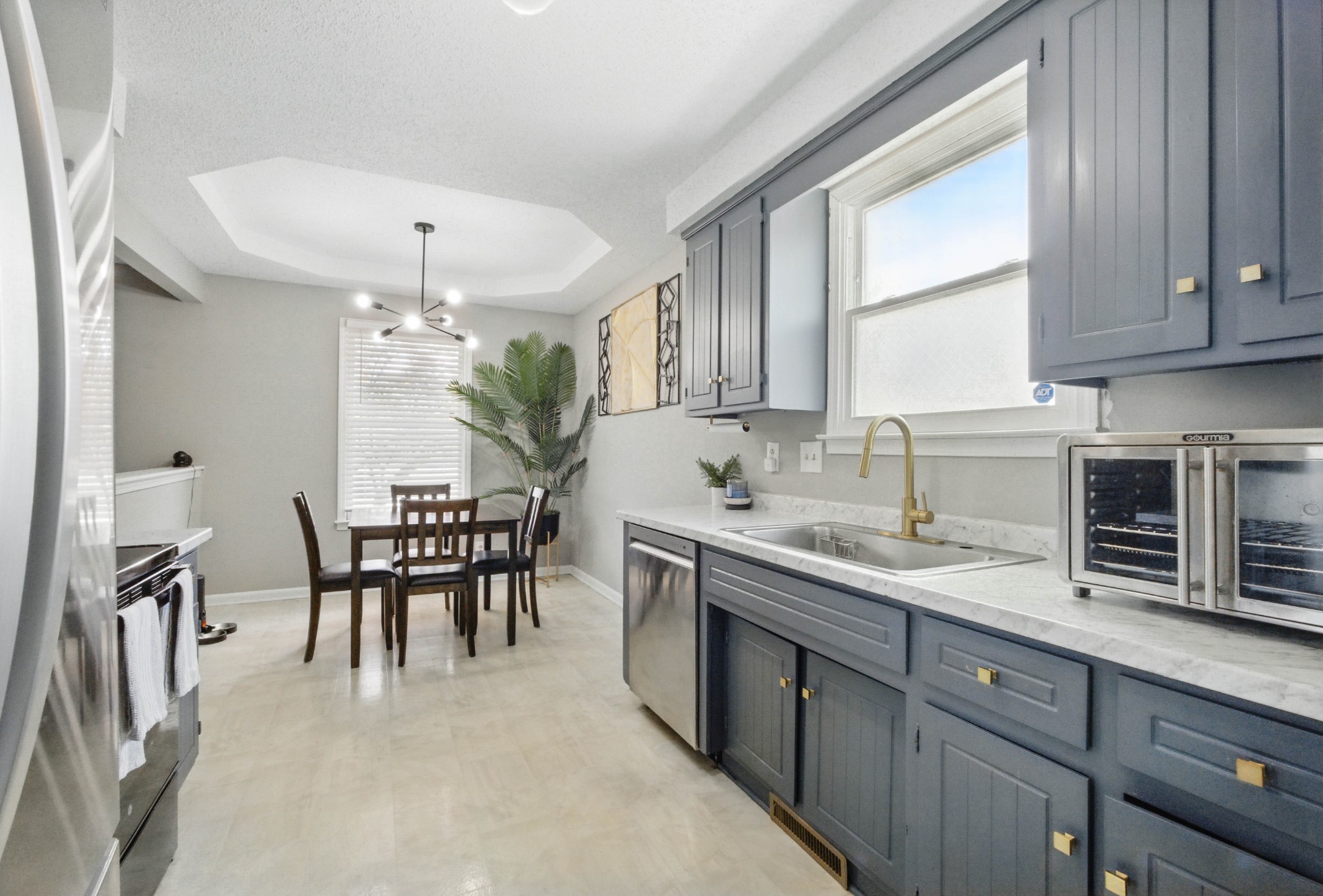763 Needmore Road Clarksville, TN 37040 - Photo 8 of 43 a kitchen with a table chairs sink and cabinets