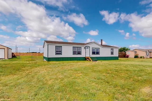 a view of an ocean and houses