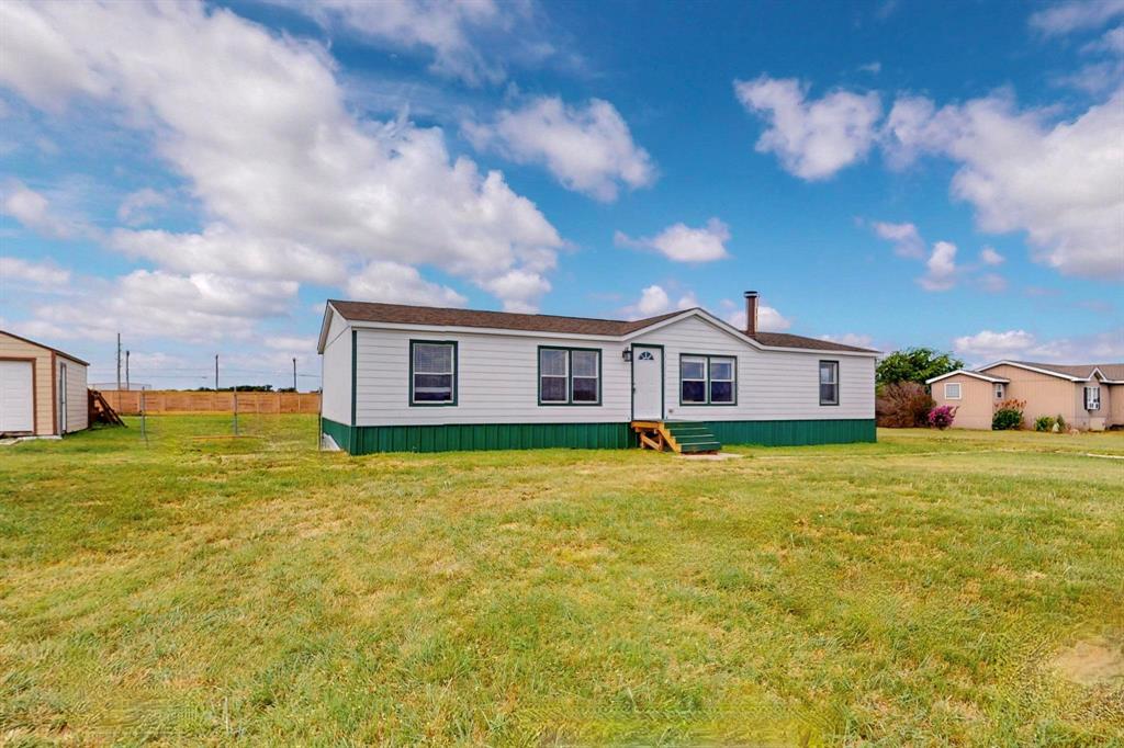 1406 Grand Prix Court Rhome, TX 76078 - Photo 2 of 12 Large Front yard