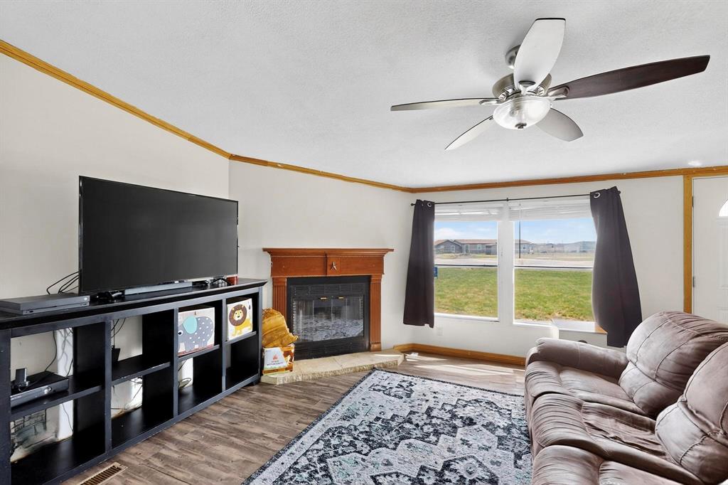 1406 Grand Prix Court Rhome, TX 76078 - Photo 7 of 12 a living room with furniture and a flat screen tv