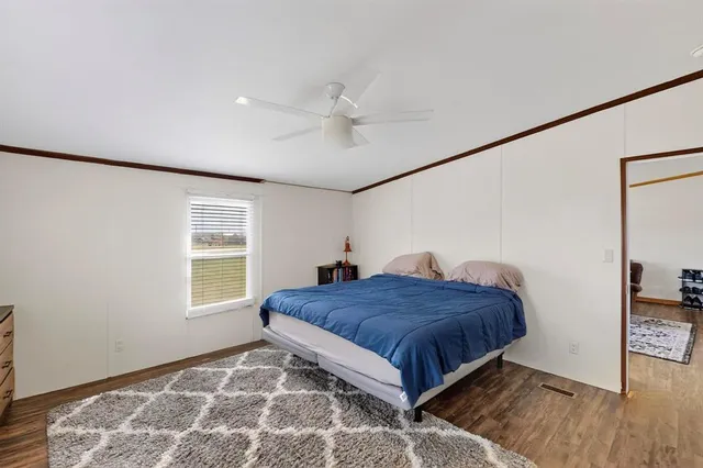 a bedroom with a bed and television