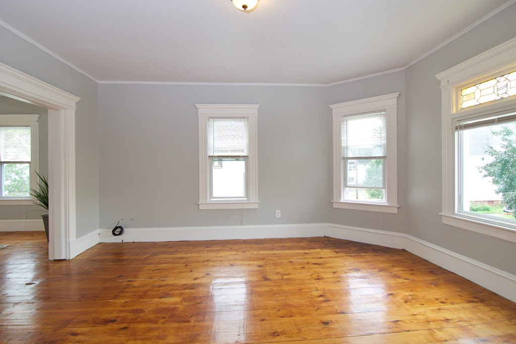 45 Malden Street Springfield, MA 01108 - Photo 11 of 30 a view of empty room with wooden floor and fan