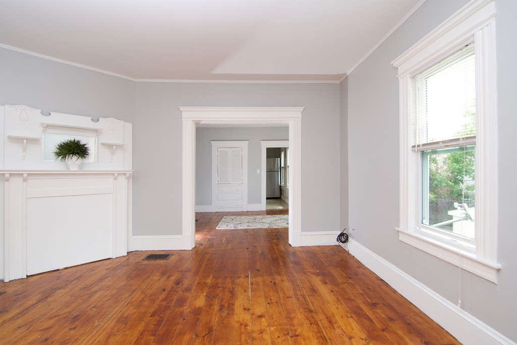 45 Malden Street Springfield, MA 01108 - Photo 12 of 30 a view of empty room with wooden floor and fan