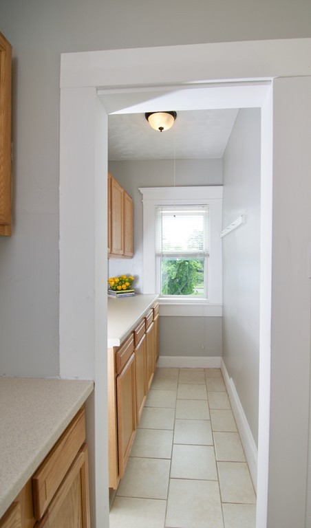 45 Malden Street Springfield, MA 01108 - Photo 4 of 30 a large white kitchen with a sink
