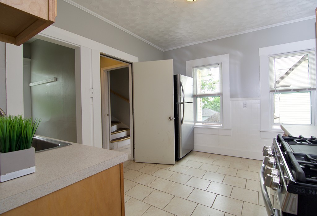 45 Malden Street Springfield, MA 01108 - Photo 5 of 30 a view of kitchen filled with furniture and window