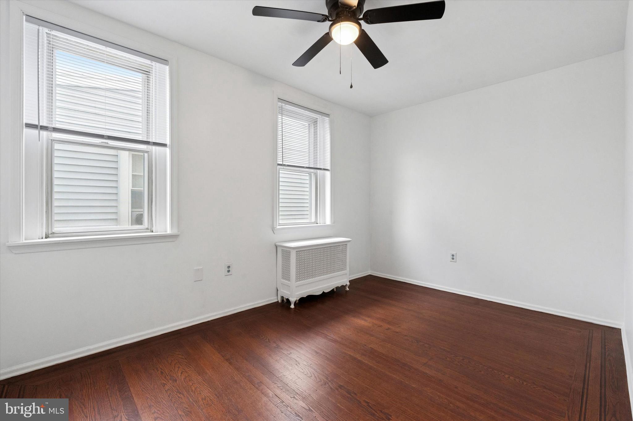 4489 Livingston Street Philadelphia, PA 19137 - Photo 14 of 25 a view of empty room with wooden floor and fan