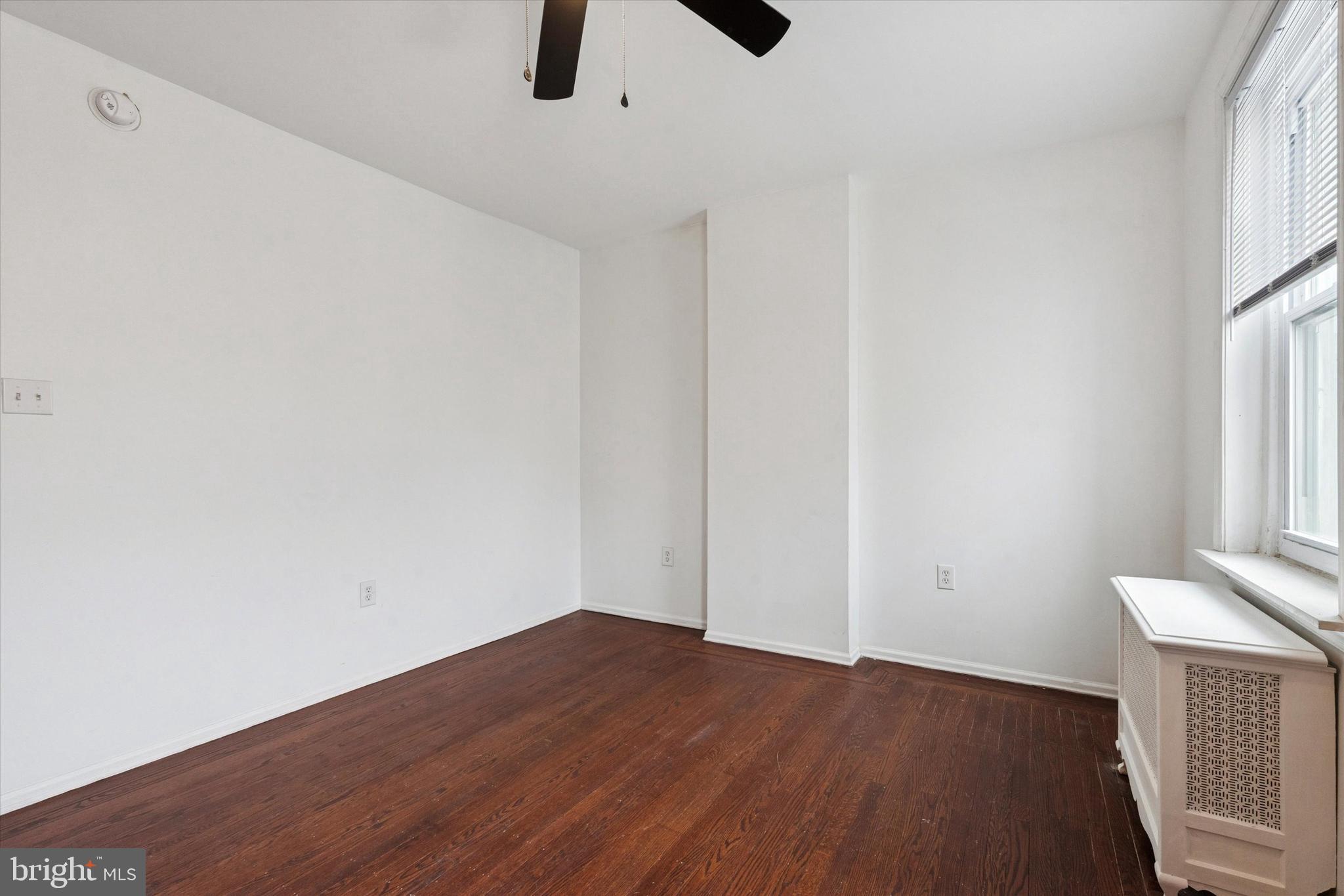 4489 Livingston Street Philadelphia, PA 19137 - Photo 17 of 25 a view of an empty room with wooden floor