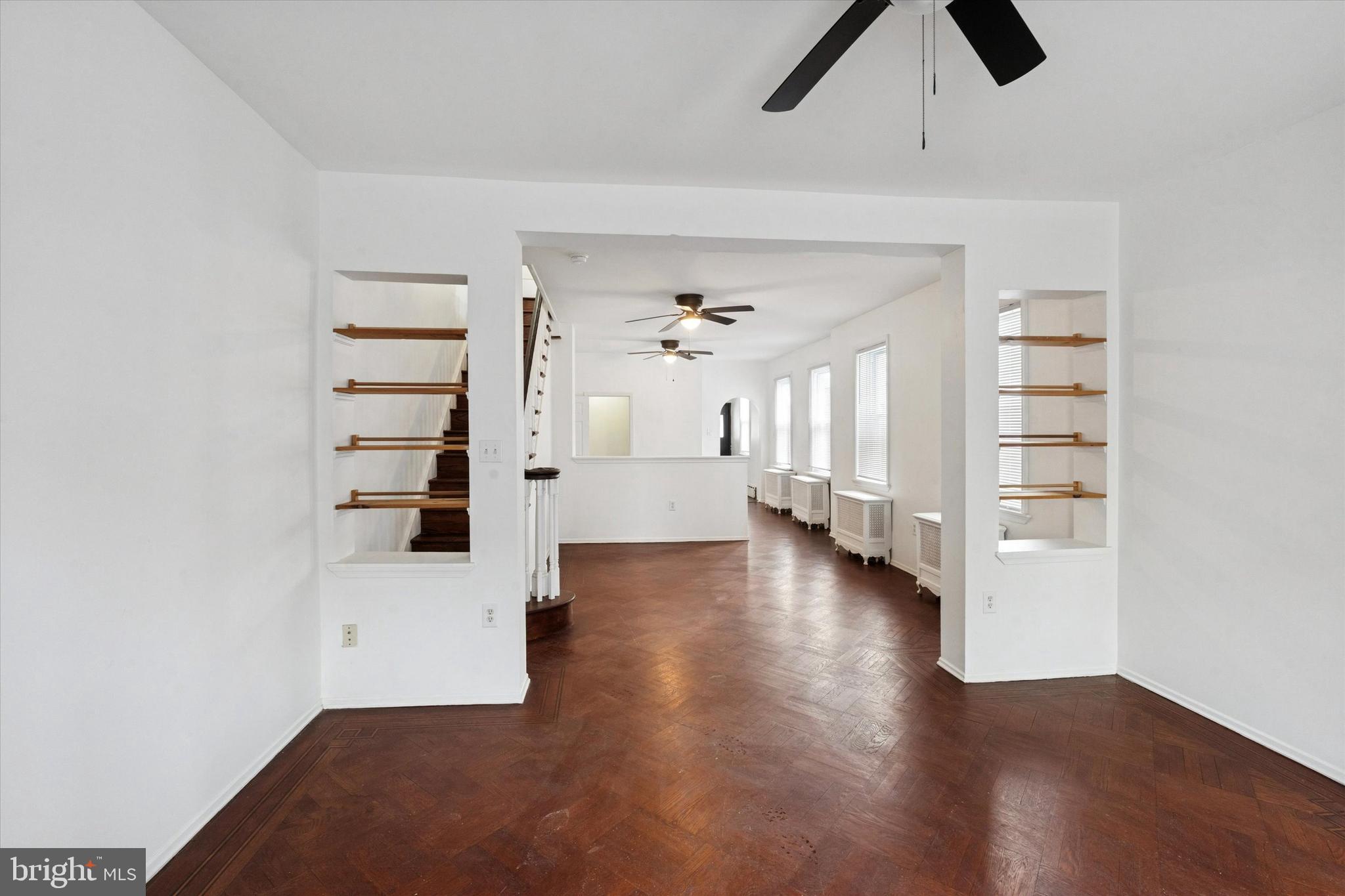 4489 Livingston Street Philadelphia, PA 19137 - Photo 2 of 25 wooden floor in an empty room with a window