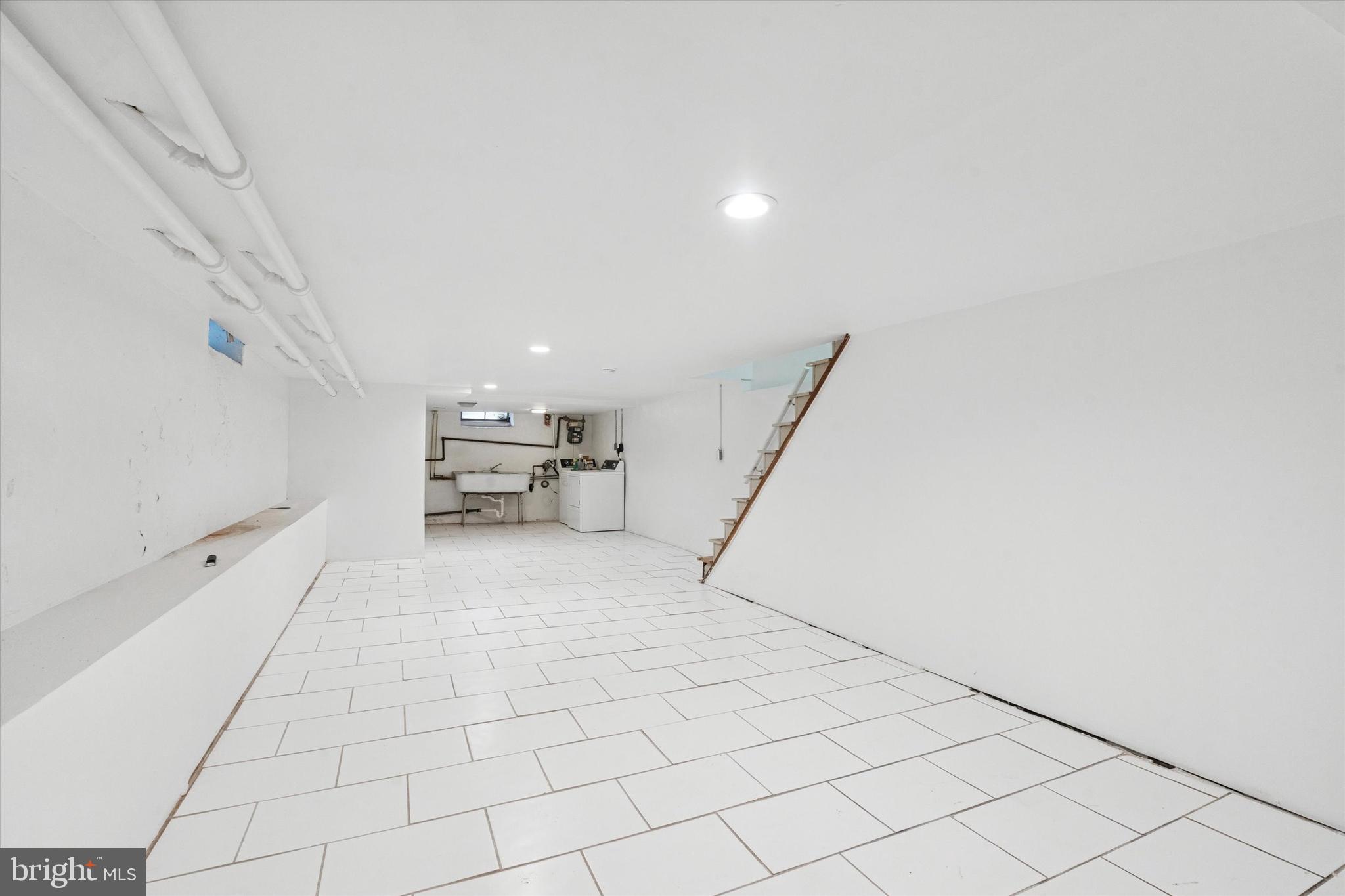 4489 Livingston Street Philadelphia, PA 19137 - Photo 22 of 25 a view of a livingroom with furniture and staircase