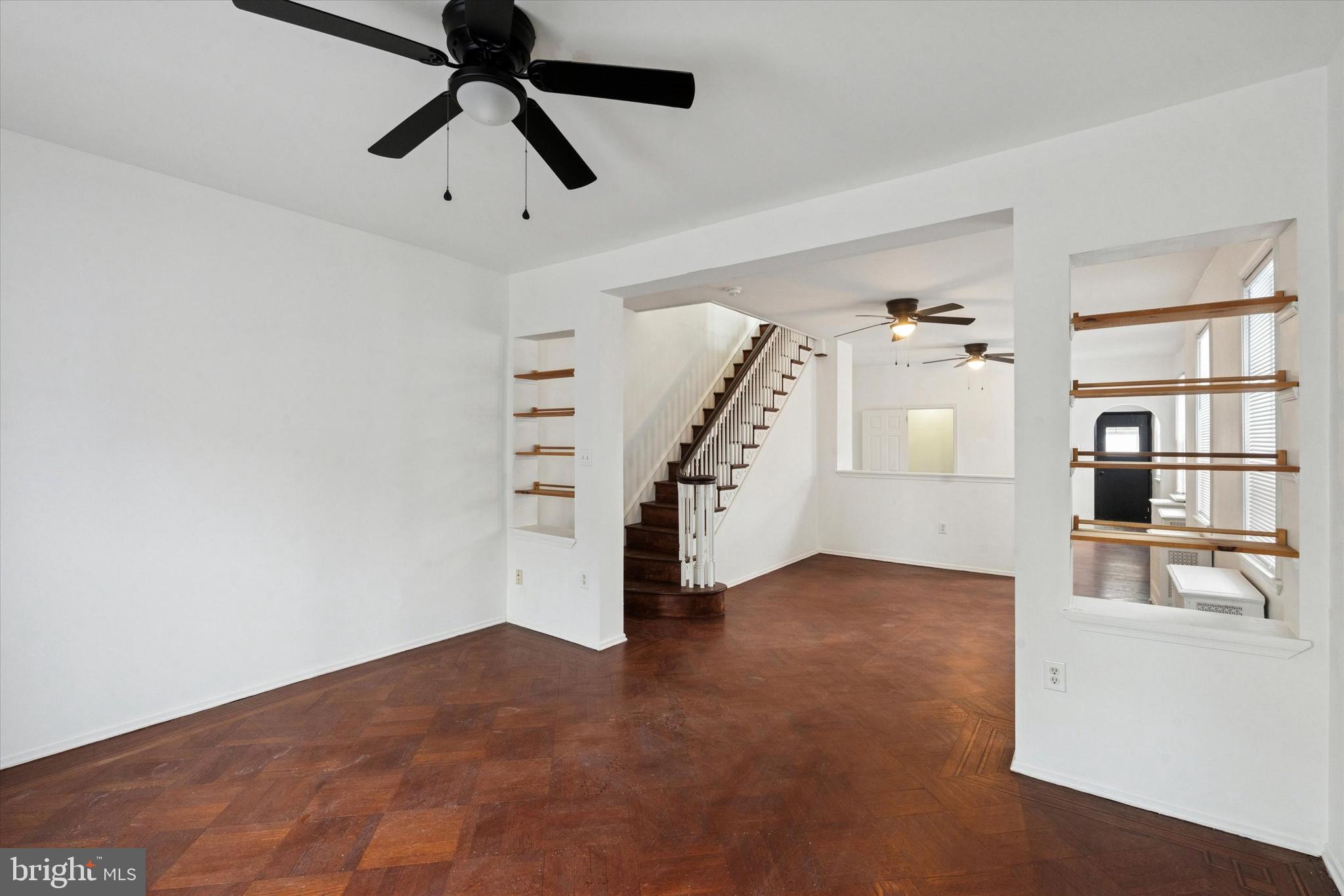 4489 Livingston Street Philadelphia, PA 19137 - Photo 3 of 25 a view of empty room with wooden floor and ceiling fan