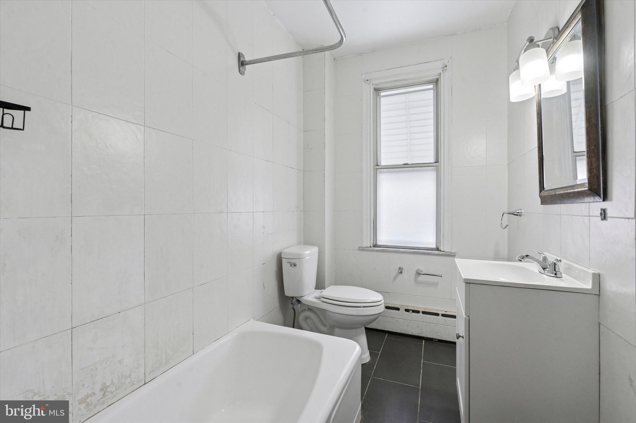 4489 Livingston Street Philadelphia, PA 19137 - Photo 10 of 25 a bathroom with a sink toilet and shower