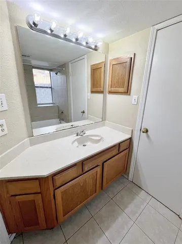 a bathroom with a sink a vanity and mirror