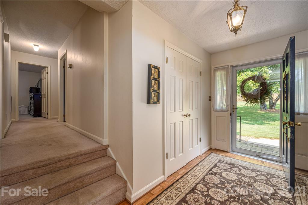 628 Hulls Grove Church Road Vale, NC 28168 - Photo 4 of 40 a view of a hallway to a livingroom with wooden floor and a window
