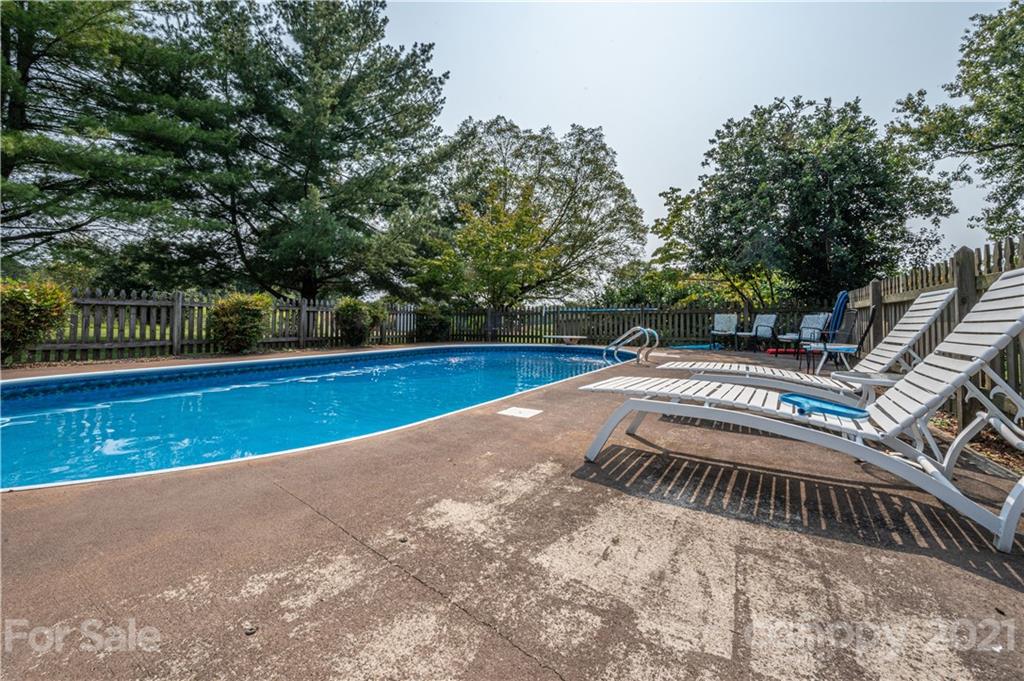 628 Hulls Grove Church Road Vale, NC 28168 - Photo 34 of 40 a view of a swimming pool with a yard and large trees