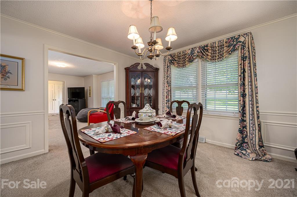 628 Hulls Grove Church Road Vale, NC 28168 - Photo 6 of 40 a view of a dining room with furniture and chandelier