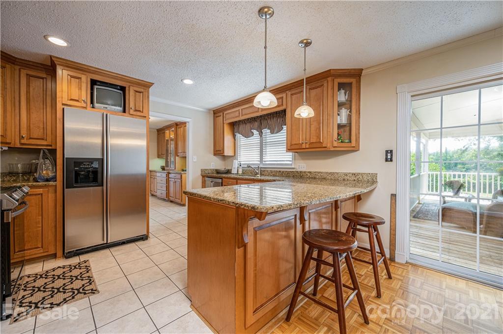 628 Hulls Grove Church Road Vale, NC 28168 - Photo 7 of 40 a kitchen with stainless steel appliances granite countertop a refrigerator a sink a stove and a cabinets