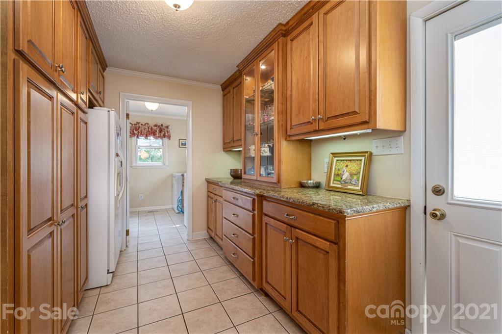 628 Hulls Grove Church Road Vale, NC 28168 - Photo 9 of 40 a kitchen with stainless steel appliances granite countertop a refrigerator and a stove