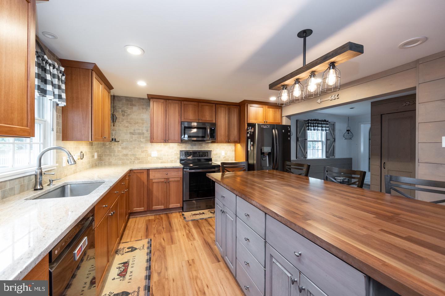 4221 Blair Mill Road Hatboro, PA 19040 - Photo 12 of 42 a large kitchen with granite countertop a large counter top appliances and cabinets