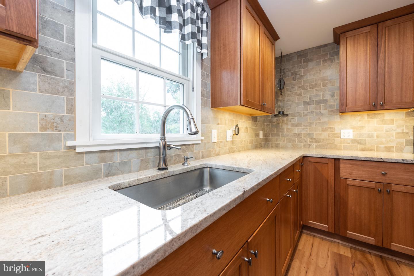 4221 Blair Mill Road Hatboro, PA 19040 - Photo 13 of 42 a kitchen with granite countertop a sink and a window