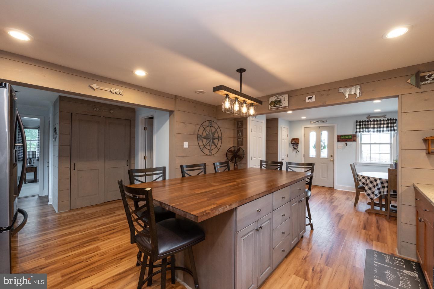 4221 Blair Mill Road Hatboro, PA 19040 - Photo 14 of 42 a kitchen with granite countertop a table chairs stove and wooden floor