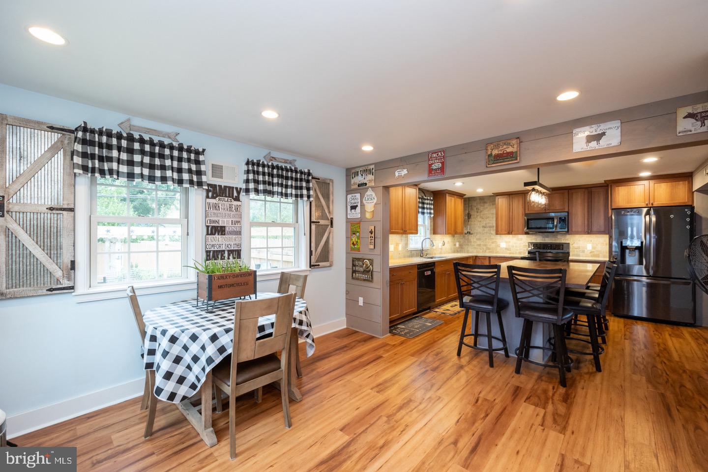 4221 Blair Mill Road Hatboro, PA 19040 - Photo 18 of 42 a dining room with furniture wooden floor and kitchen view