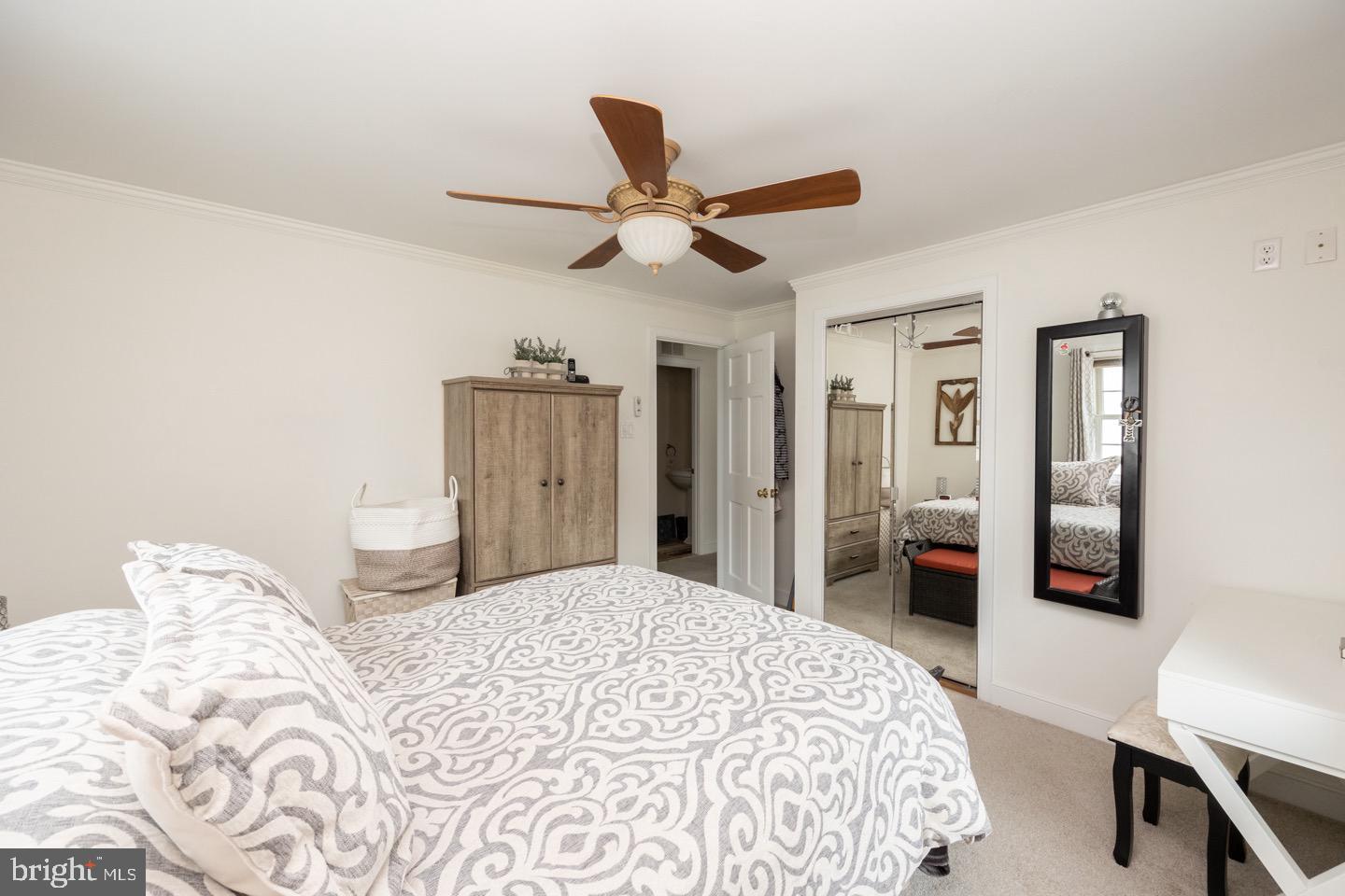 4221 Blair Mill Road Hatboro, PA 19040 - Photo 21 of 42 a bedroom with a bed and a chandelier